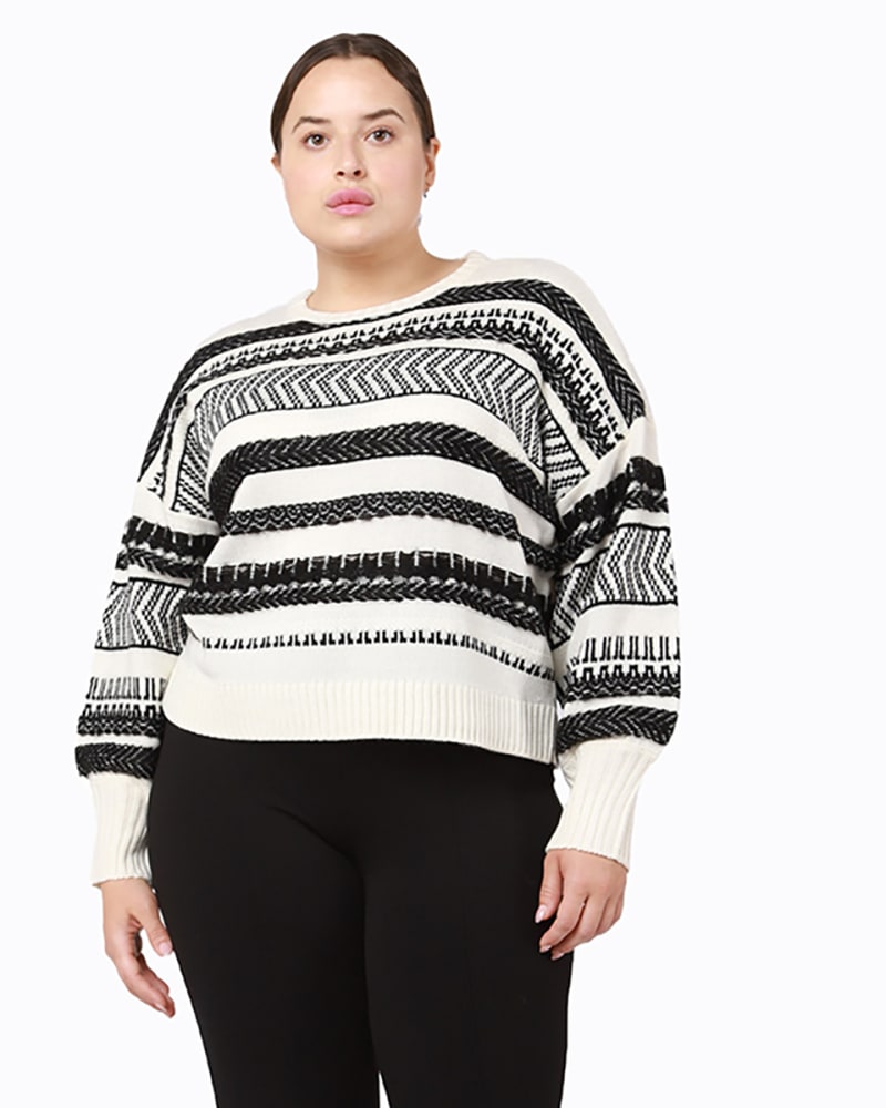 Front of a model wearing a size 0X Peyton Fringe Knit Sweater in Black / White by DEX PLUS. | dia_product_style_image_id:234118